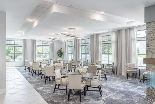 Modern clubhouse featuring stylish seating and entertainment areas at Overture West Ashley Apartments