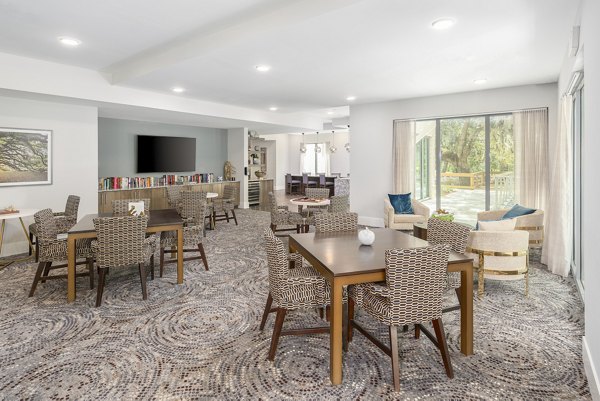 Elegant clubhouse with modern decor at Overture West Ashley Apartments, perfect for social gatherings and events