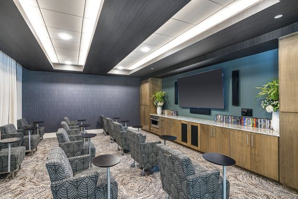 Luxurious theater room with plush seating in Overture West Ashley Apartments, ideal for movie nights and entertainment