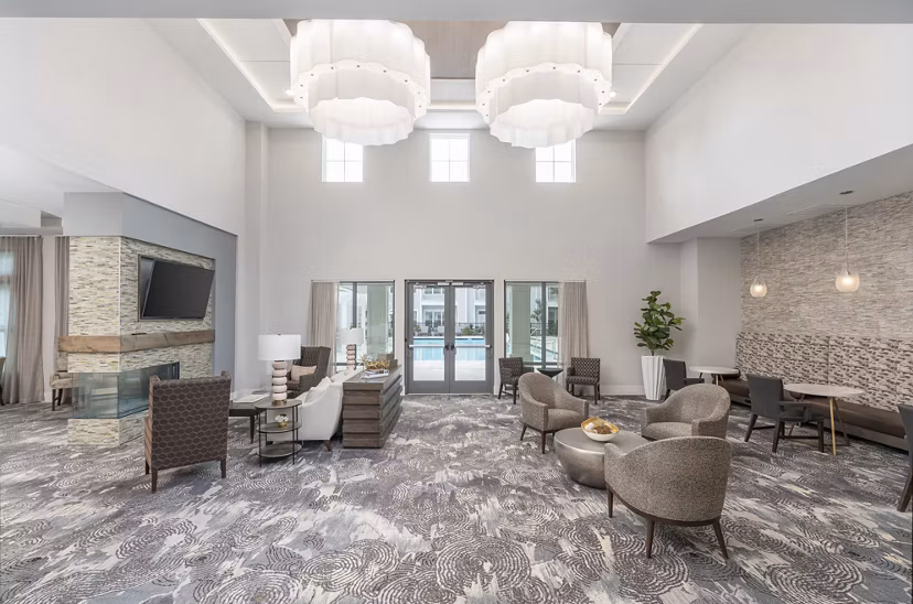 Luxurious clubhouse with modern furnishings at Overture West Ashley Apartments: Perfect space for social gatherings and events