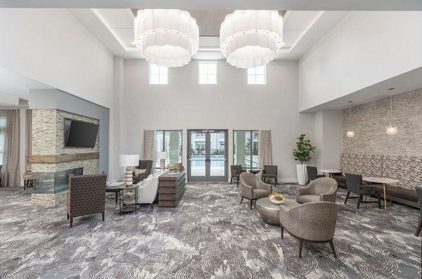 Luxurious clubhouse with modern furnishings at Overture West Ashley Apartments: Perfect space for social gatherings and events