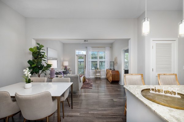 Elegant dining area with modern decor at Overture West Ashley Apartments, providing a luxury living experience