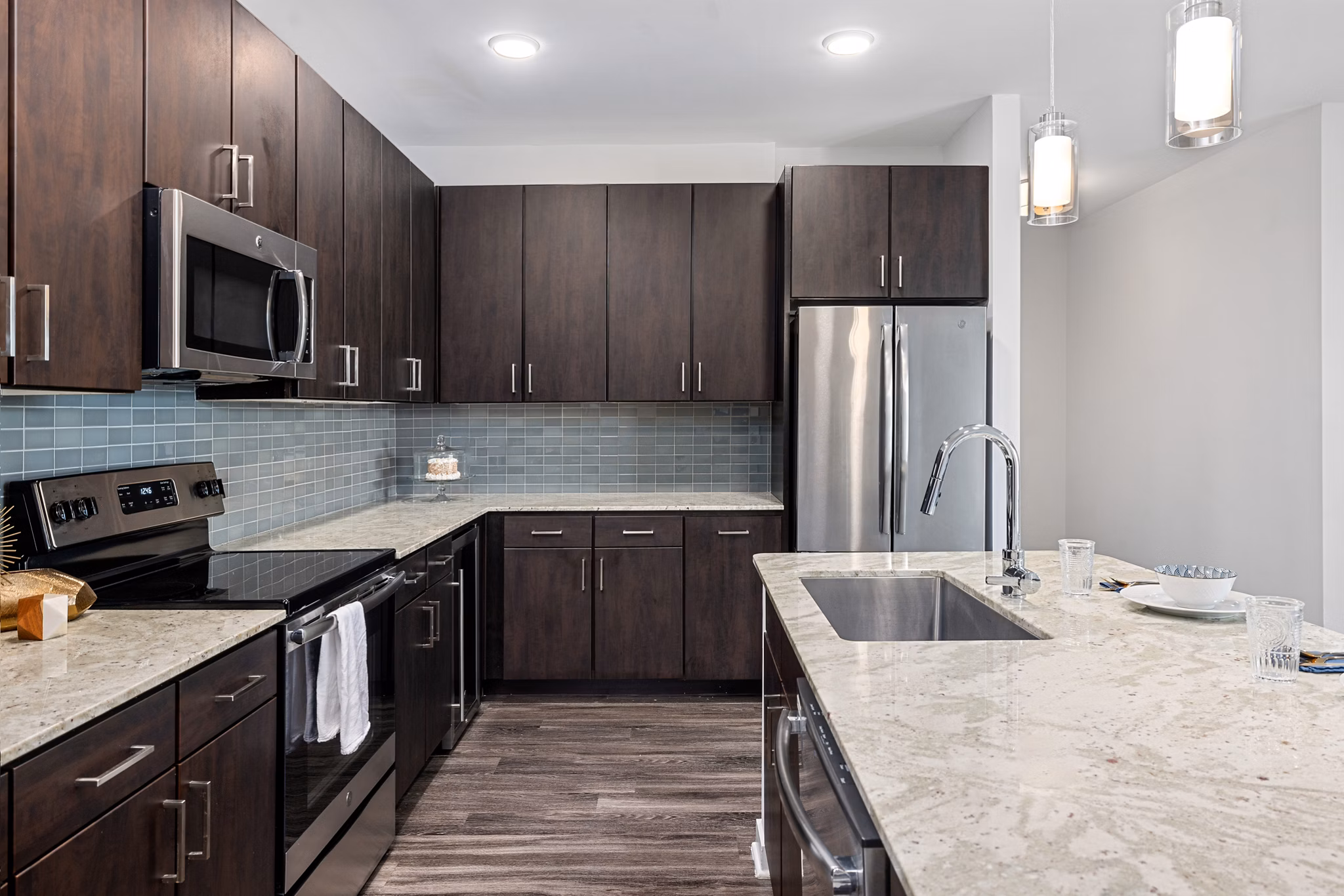 Modern kitchen with stainless steel appliances at Overture West Ashley Apartments
