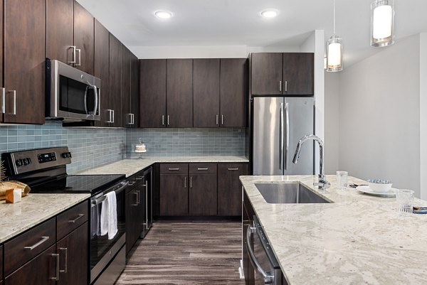 Modern kitchen with stainless steel appliances at Overture West Ashley Apartments