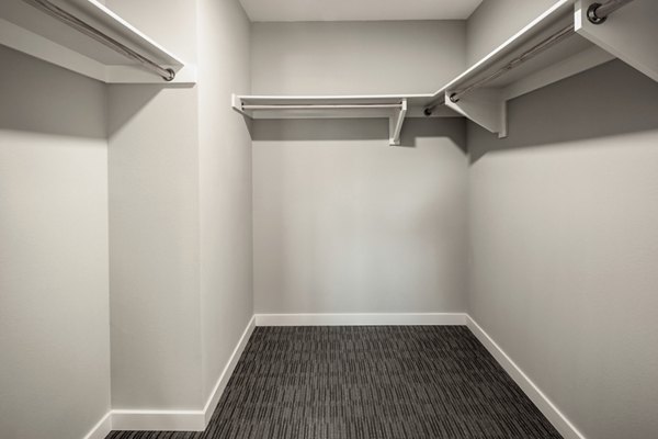 Spacious closet with ample shelving at AV8 Apartments, ideal for organized storage in a luxury living space