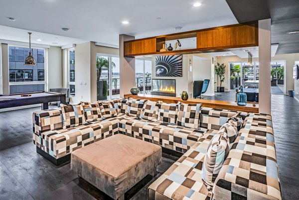 AV8 Apartments: Modern clubhouse featuring luxurious design elements and ample seating areas