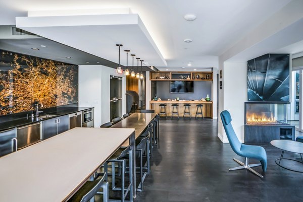 Clubhouse featuring modern lounge seating at AV8 Apartments