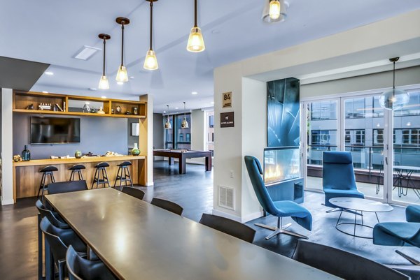 Clubhouse with modern design and cozy seating at AV8 Apartments in a luxury setting