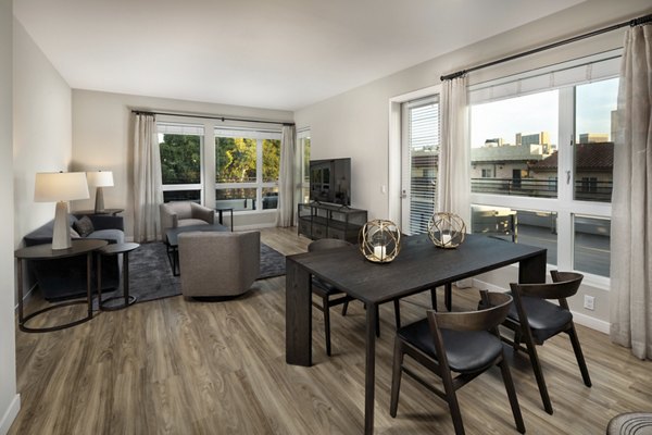 Dining area featuring sleek modern furniture at AV8 Apartments