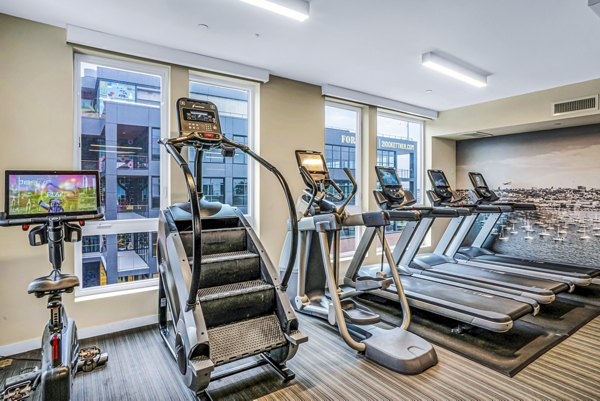 State-of-the-art fitness center featuring modern equipment at AV8 Apartments, ideal for luxury living and active lifestyles