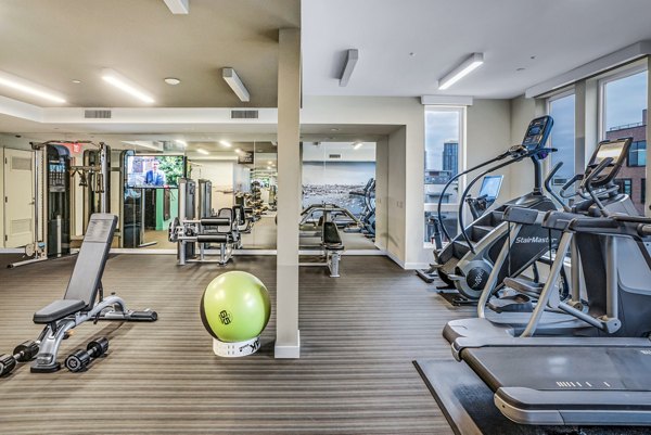 State-of-the-art fitness center with modern equipment at AV8 Apartments, perfect for residents seeking a luxury lifestyle in a prime location