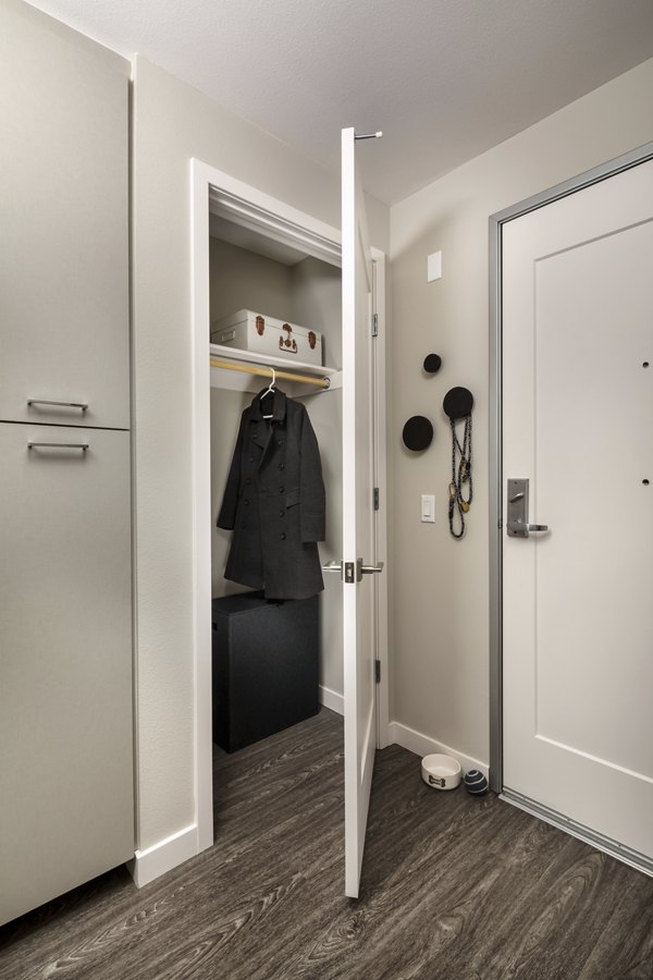 Sleek hallway with contemporary lighting at AV8 Apartments