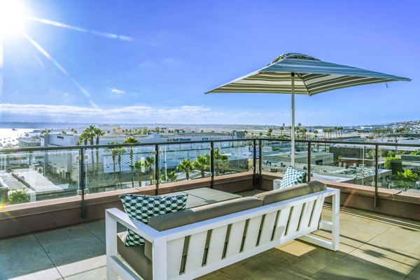 Spacious patio with modern furnishings at AV8 Apartments