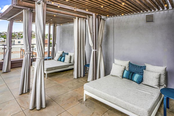 Patio with modern outdoor seating at AV8 Apartments, luxury living spaces by Greystar in a vibrant urban setting