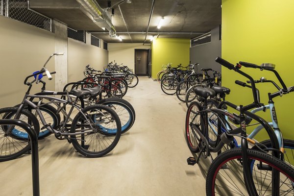 Secure bike storage at AV8 Apartments, featuring modern design and ample space for residents' convenience in a luxury setting