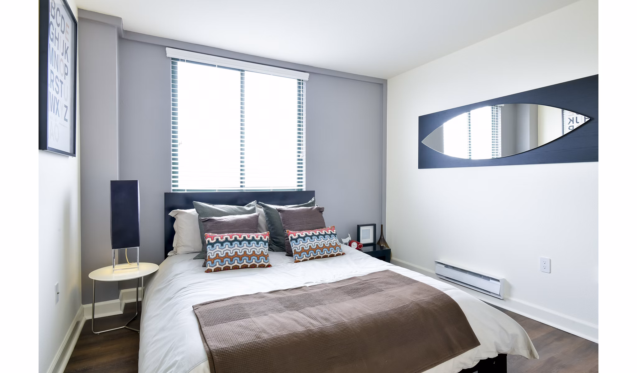 Cozy bedroom with modern decor at The Fillmore Center Apartments, a luxury Greystar property in vibrant San Francisco