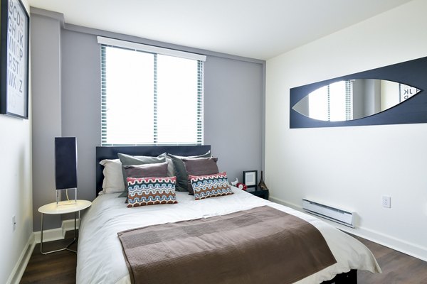 Cozy bedroom with modern decor at The Fillmore Center Apartments, a luxury Greystar property in vibrant San Francisco