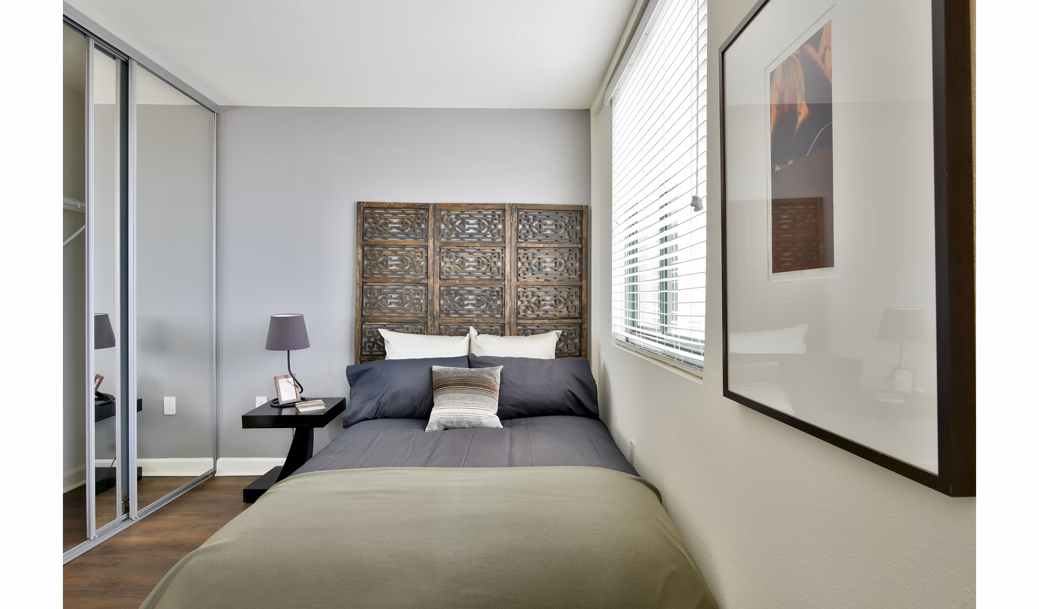 Cozy studio bedroom with modern furnishings at The Fillmore Center Apartments in a  community