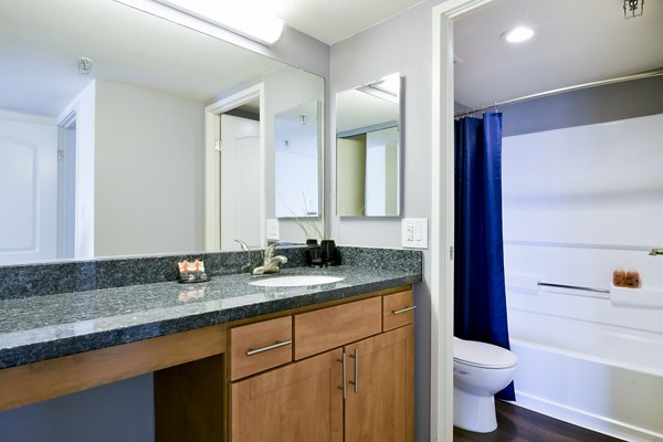 Spacious bathroom featuring modern fixtures at The Fillmore Center Apartments