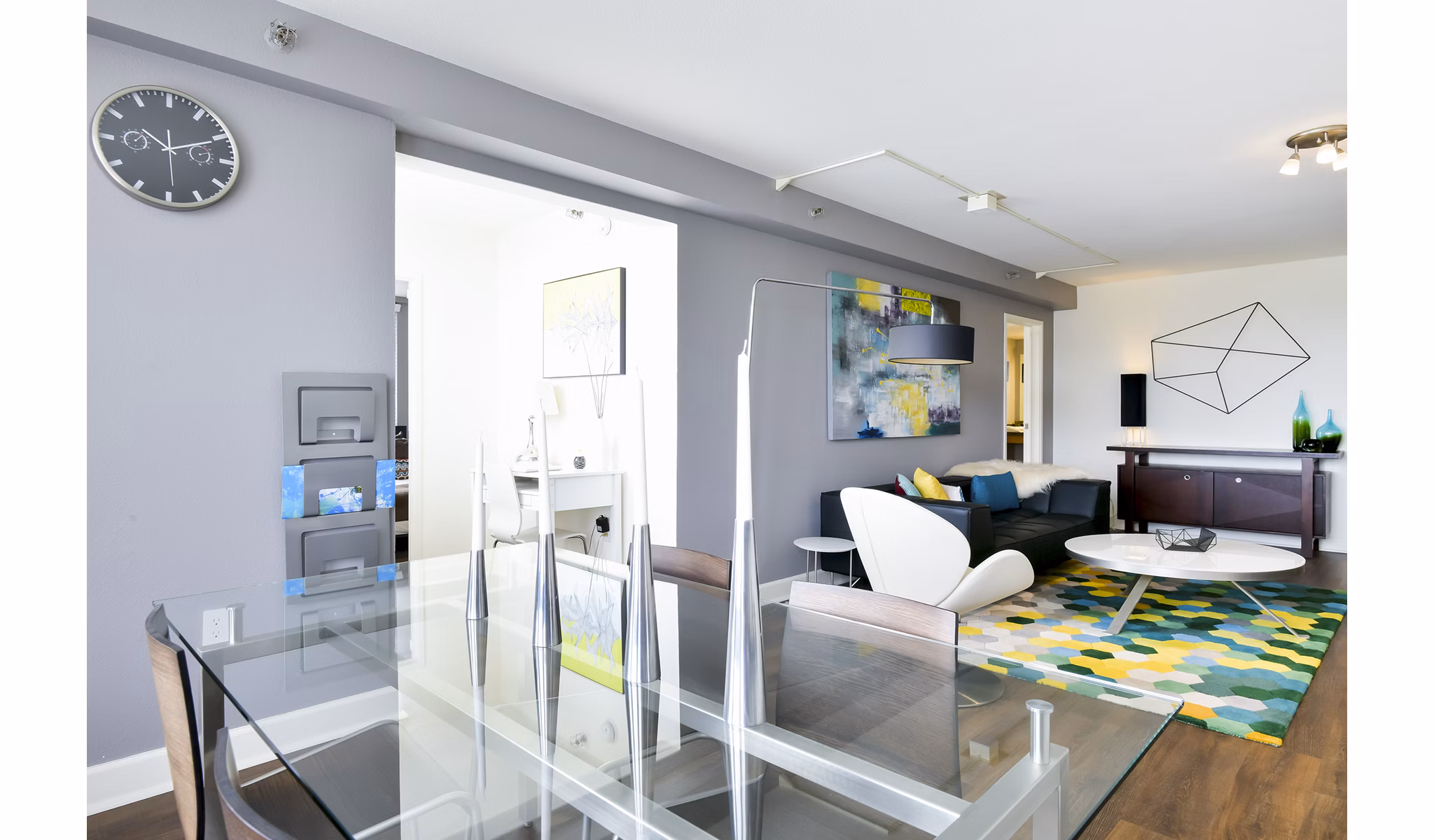 Dining room with modern decor and large windows at The Fillmore Center Apartments