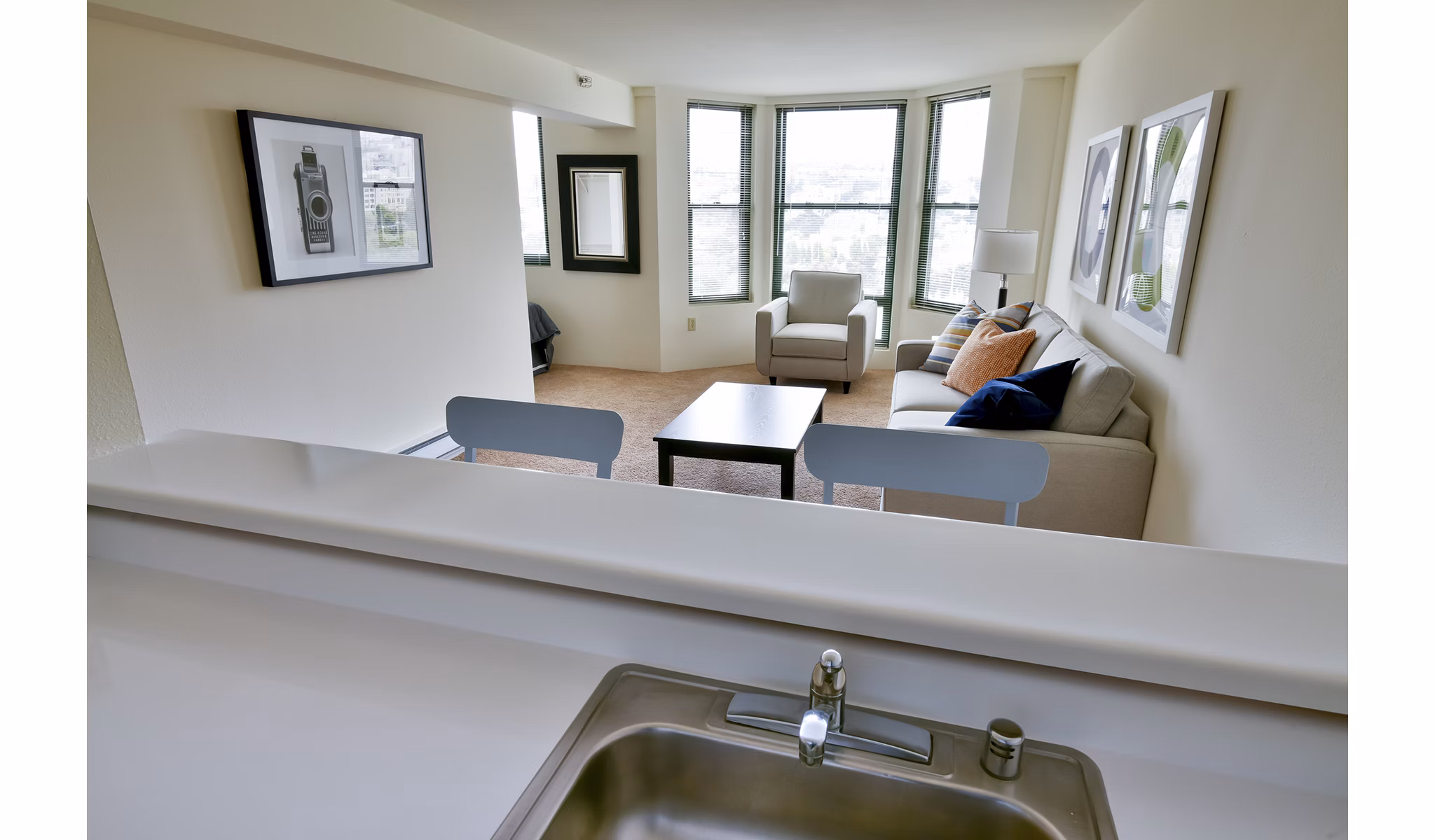 Modern kitchen featuring stainless steel appliances at The Fillmore Center Apartments