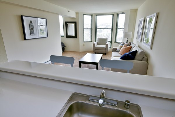 Modern kitchen featuring stainless steel appliances at The Fillmore Center Apartments