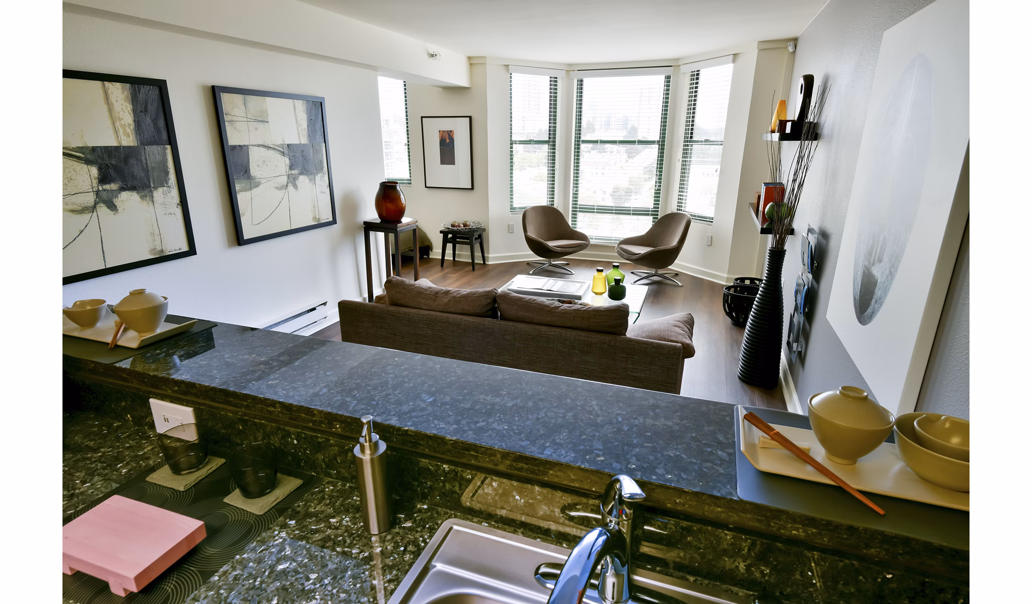 Modern kitchen with stainless steel appliances at The Fillmore Center Apartments