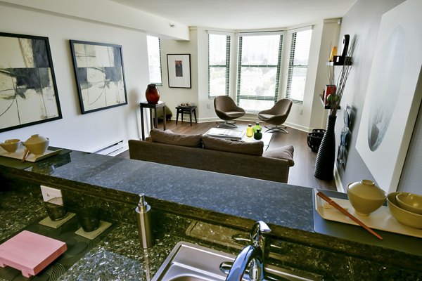 Modern kitchen with stainless steel appliances at The Fillmore Center Apartments