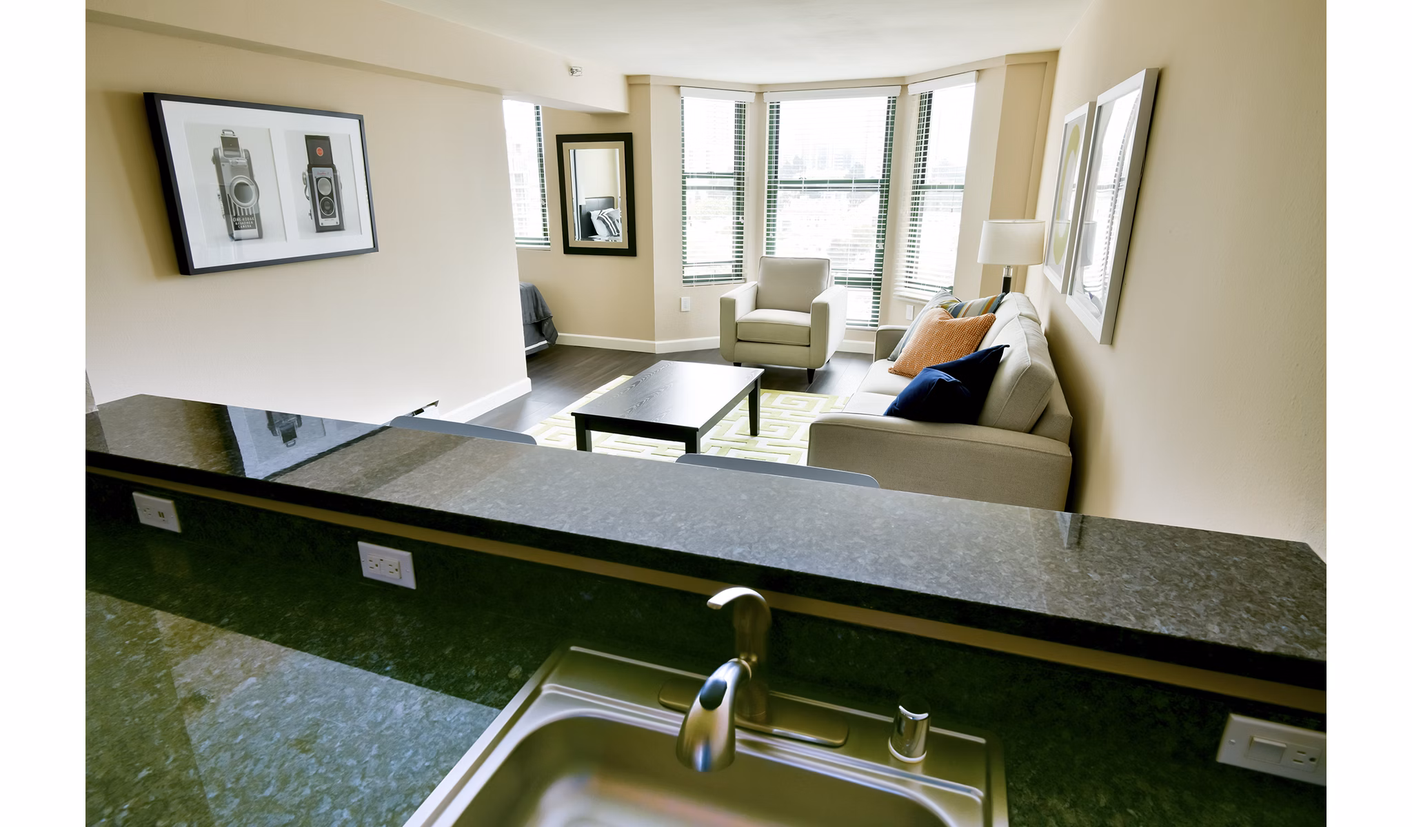 Modern kitchen with stainless steel appliances at The Fillmore Center Apartments in luxury Greystar community