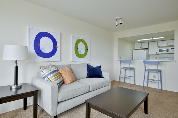 Spacious living room with modern furnishings in The Fillmore Center Apartments at Greystar luxury apartments