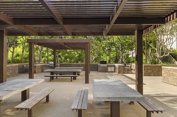 Outdoor grill area at The Fillmore Center with modern seating and community-friendly design