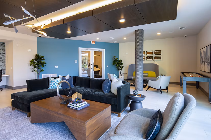 Luxurious clubhouse featuring modern design and spacious seating at Encore Montrose Apartments
