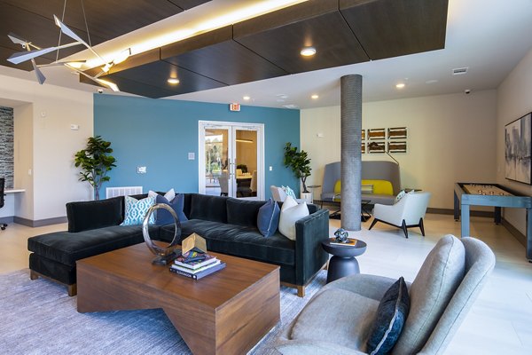 Luxurious clubhouse featuring modern design and spacious seating at Encore Montrose Apartments