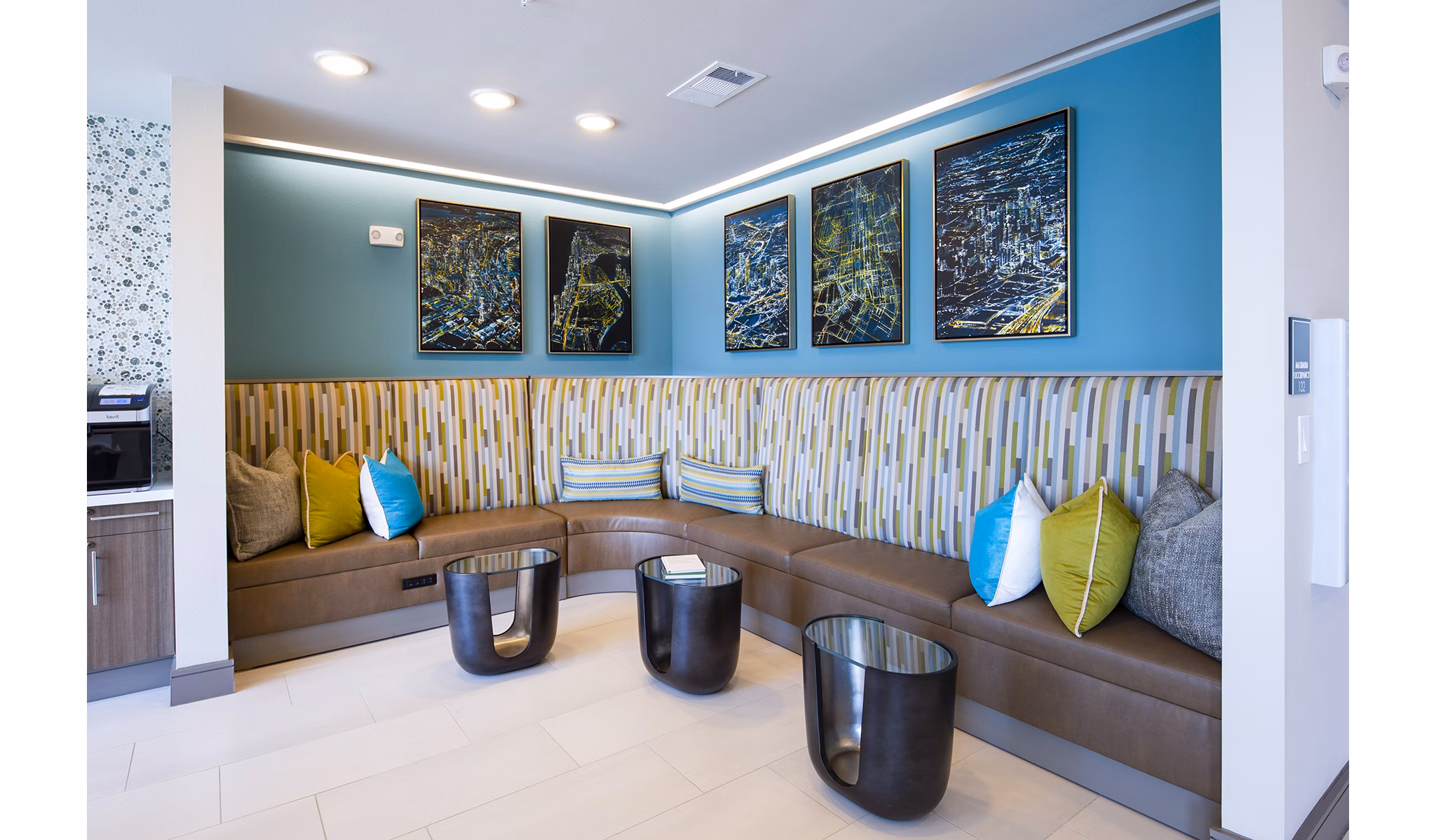 Clubhouse featuring modern decor and seating at Encore Montrose Apartments, an exclusive community offering luxury lifestyle amenities for residents