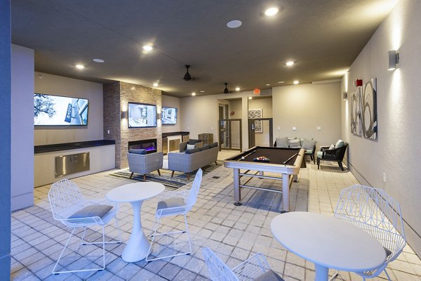 Game room featuring pool table and seating area at Encore Montrose Apartments, luxury rental homes in a prime urban setting