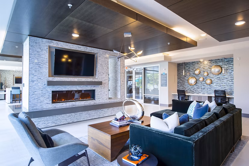 Stylish clubhouse with modern design at Encore Montrose Apartments, ideal for social gatherings and events