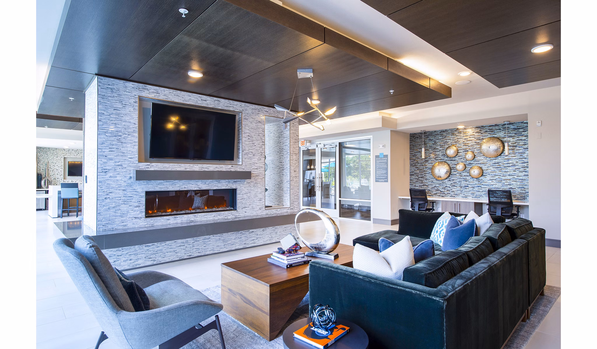 Stylish clubhouse with modern design at Encore Montrose Apartments, ideal for social gatherings and events