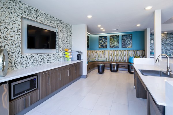 Clubhouse featuring modern seating and dÃ©cor at Encore Montrose Apartments