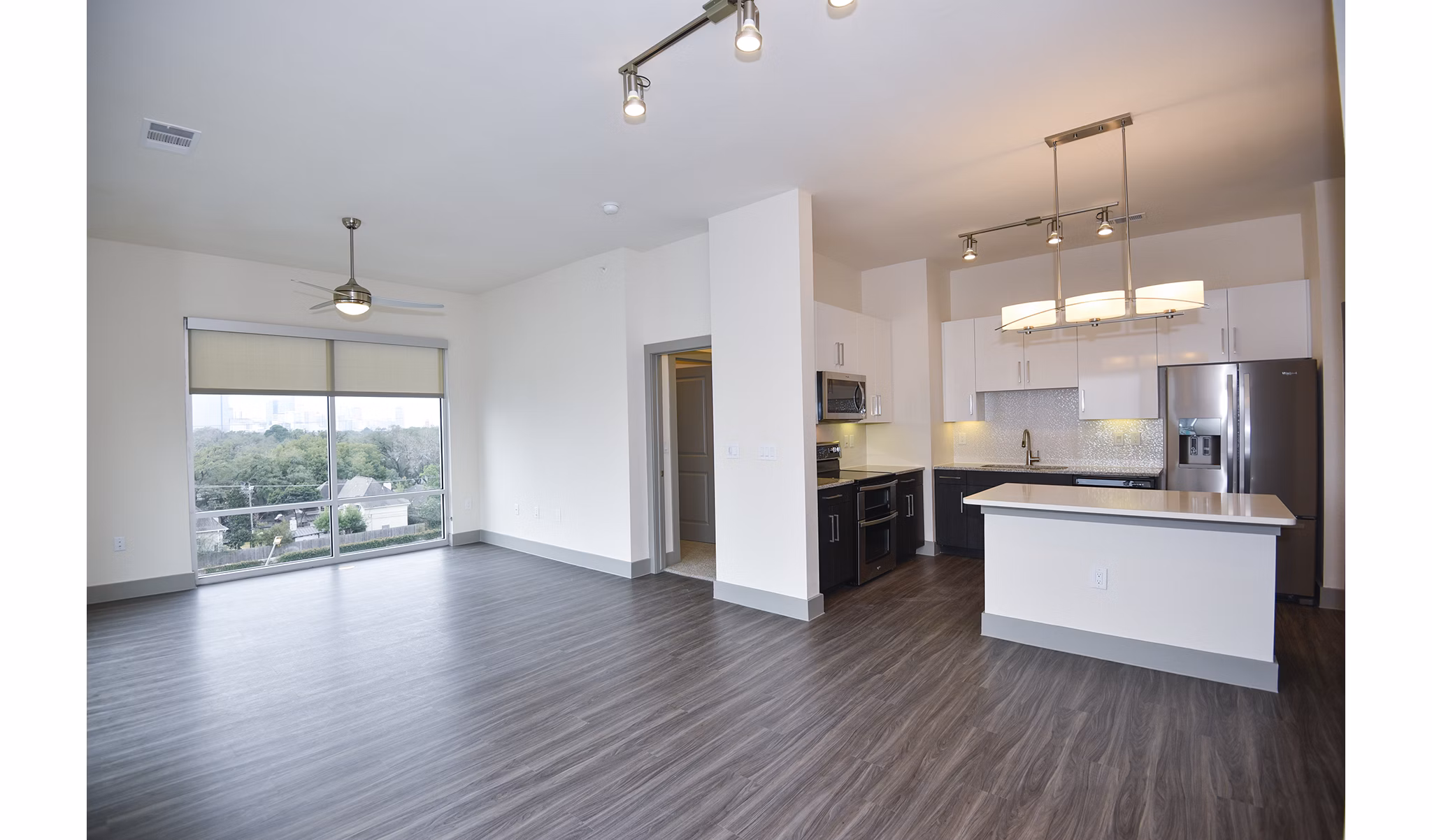 Cozy living room with chic decor in Encore Montrose Apartments, featuring modern furnishings and ample natural light