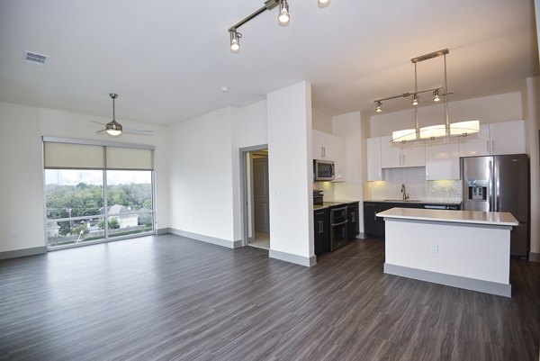 Cozy living room with chic decor in Encore Montrose Apartments, featuring modern furnishings and ample natural light