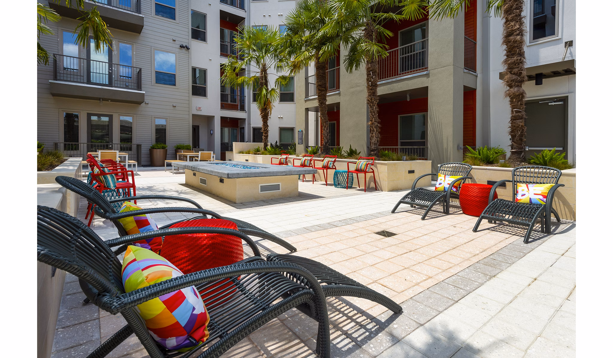 Cozy fire pit area at Encore Montrose Apartments, perfect for social gatherings and relaxation