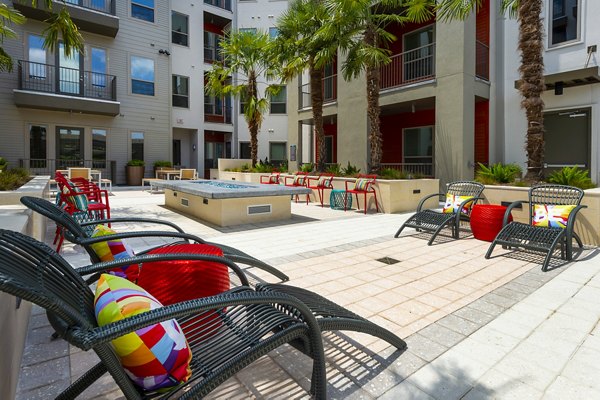 Cozy fire pit area at Encore Montrose Apartments, perfect for social gatherings and relaxation