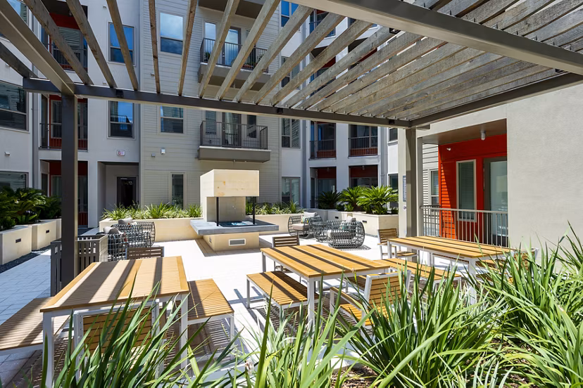 Patio with stylish outdoor seating at Encore Montrose Apartments, luxury living in a vibrant Houston neighborhood