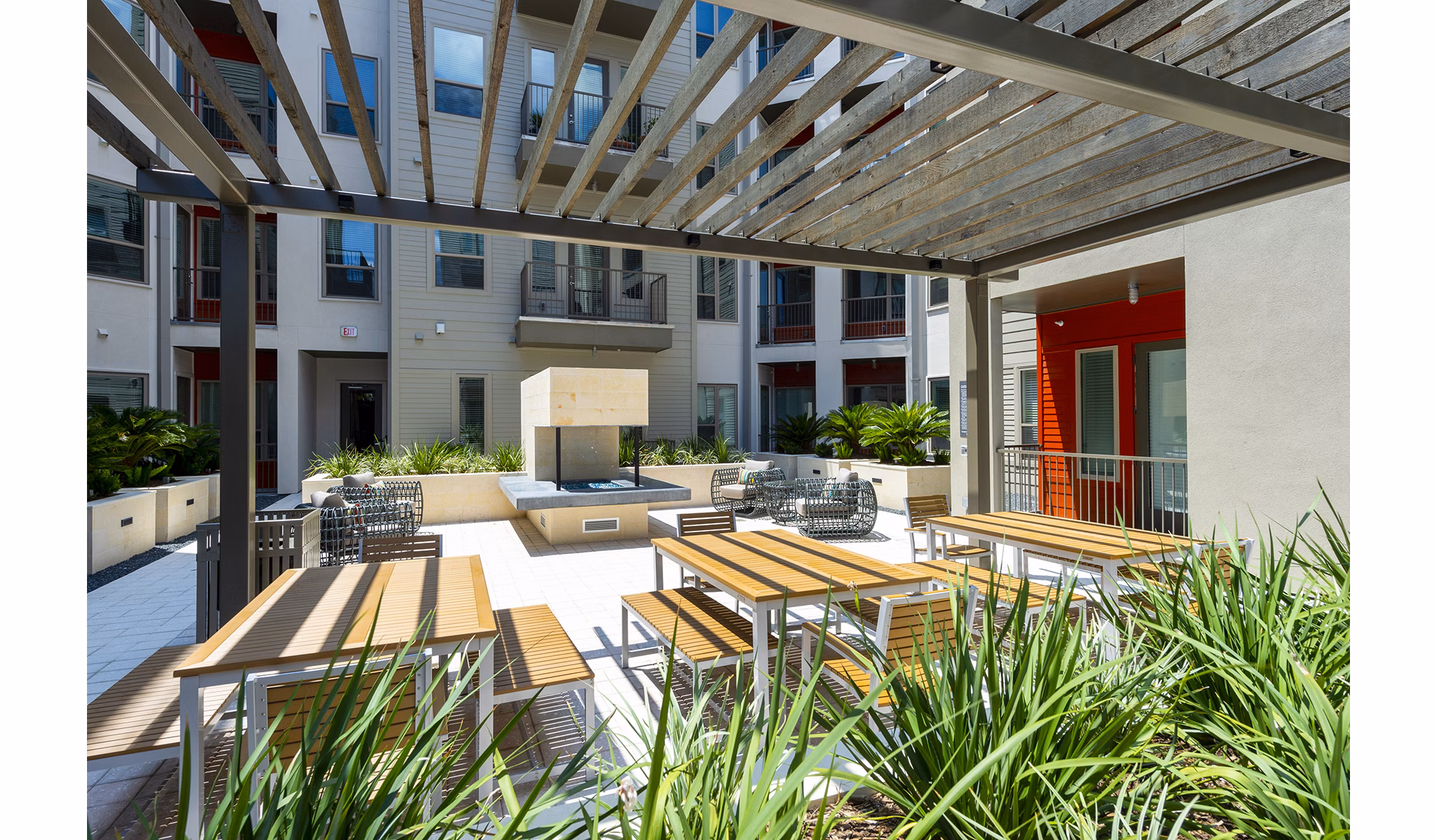 Patio with stylish outdoor seating at Encore Montrose Apartments, luxury living in a vibrant Houston neighborhood