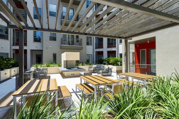 Patio with stylish outdoor seating at Encore Montrose Apartments, luxury living in a vibrant Houston neighborhood