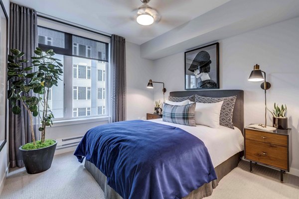 Cozy bedroom with stylish decor at Marlowe Apartments