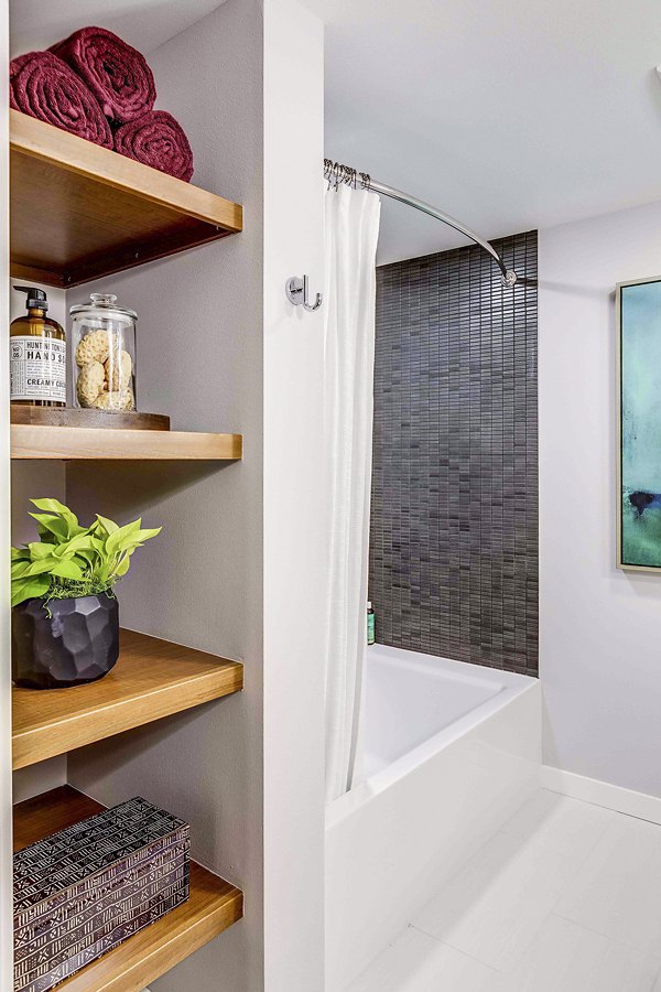 Bathroom featuring sleek fixtures and tile design at Marlowe Apartments