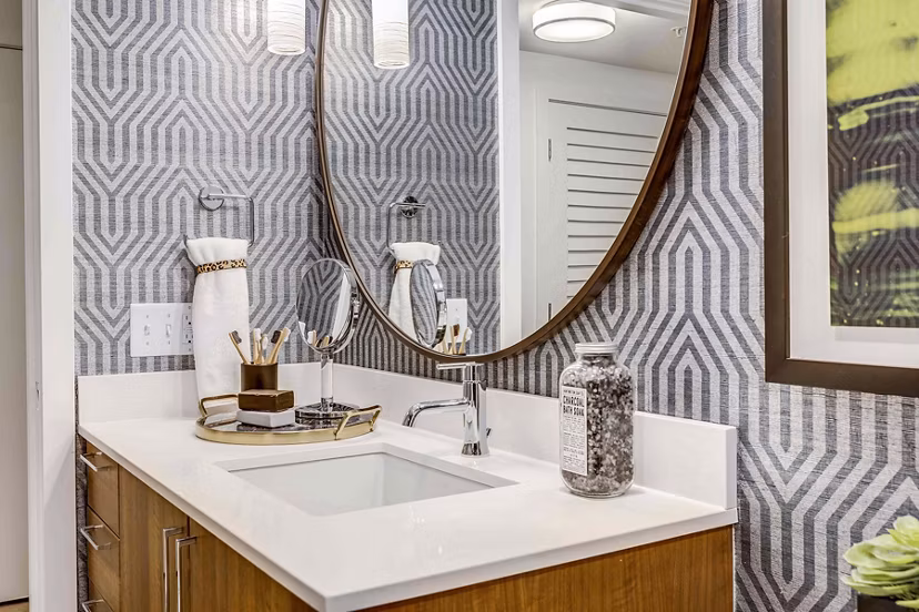 Modern bathroom featuring white marble countertops and sleek fixtures at Marlowe Apartments