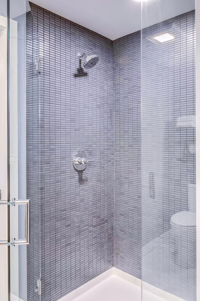 Bathroom featuring modern fixtures and stylish marble countertops in Marlowe Apartments