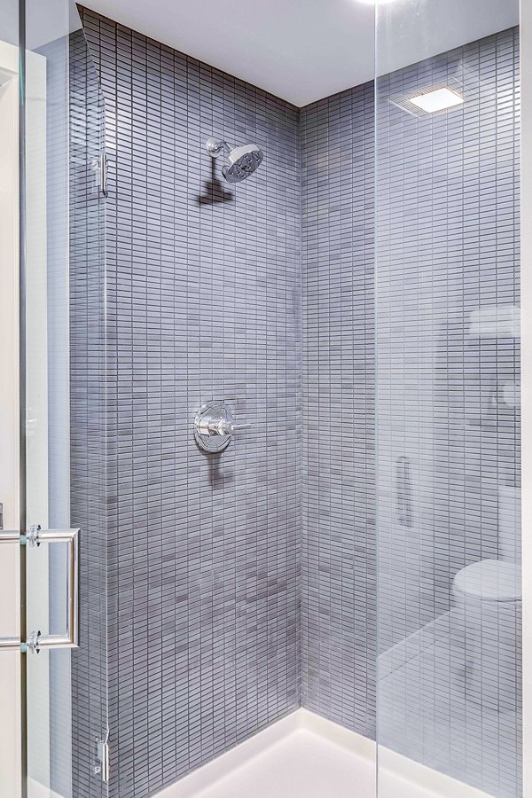 Bathroom featuring modern fixtures and stylish marble countertops in Marlowe Apartments